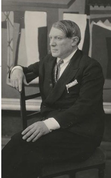 Picasso seated in a suit